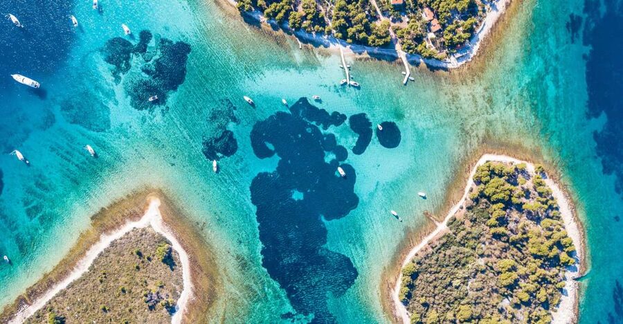 From Split: Blue Lagoon & Trogir Boat Trip with Snorkeling - Trogir’s Stone Streets and Bell Tower