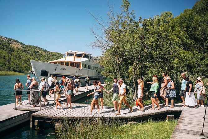 From Split: Krka Waterfalls, Food & Wine Tasting Tour - Walking the wooden paths beside Skradinski buk