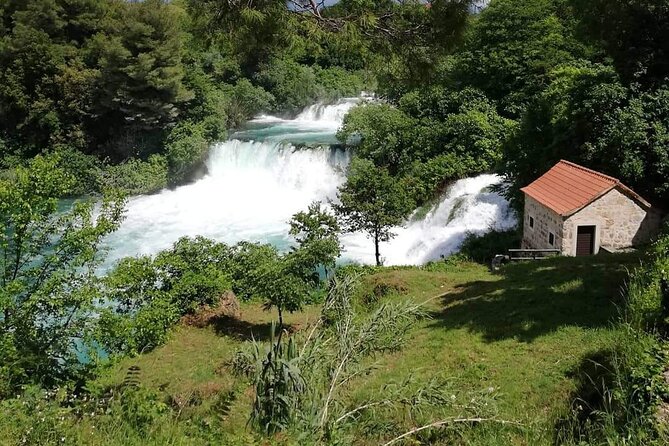 From Split or Trogir: Krka Waterfalls & Primošten Sightseeing - Šibenik adds culture, but costs you time
