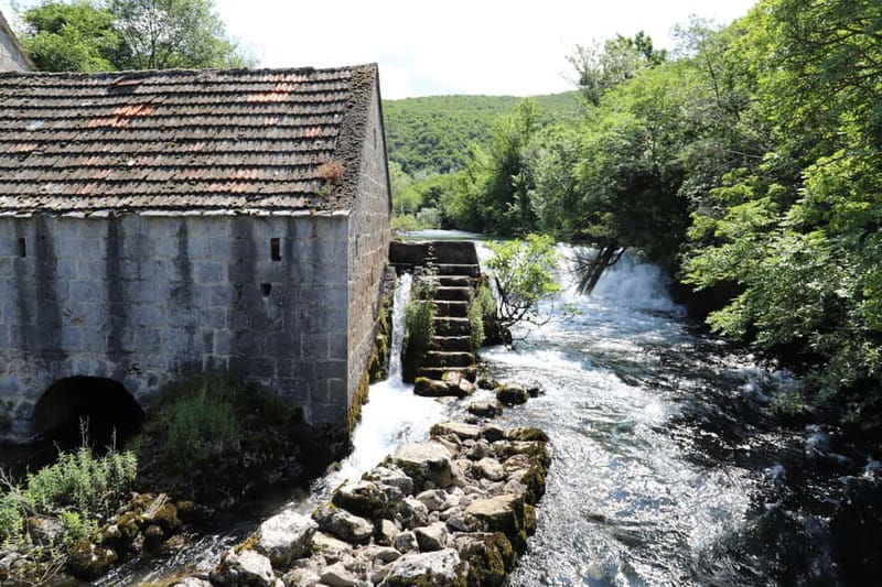From Split: Three Rivers Quad Tour with Swimming and Lunch - Riding toward the old Cetina bridge