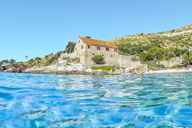 HVAR & 4 Islands PRIVATE BOAT TOUR - Trogir begins the day with stone lanes and old towers