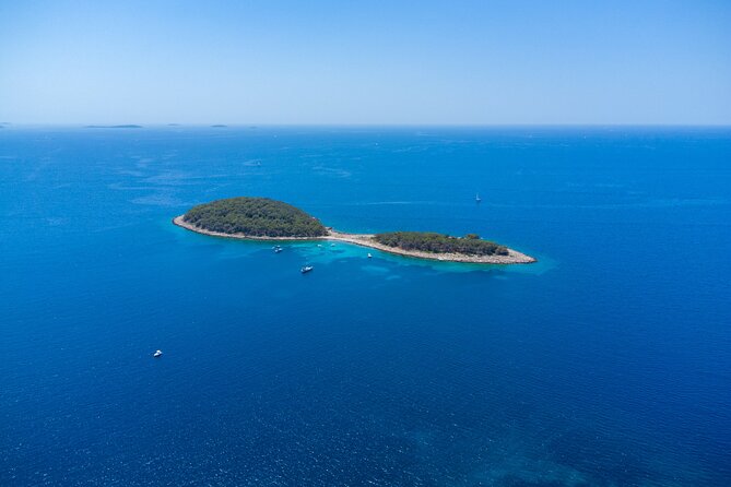 Private Boat Trip - Swim and Chill in Crystal Blue Šibenik - The Wall of Oštrica and the view toward St. Nikola Fortress