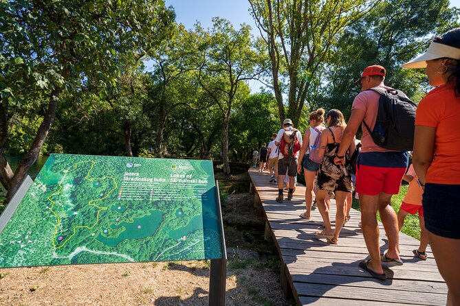 Private Krka Waterfalls tour with 30min Boat Cruse - Arriving by boat at Skradinski buk