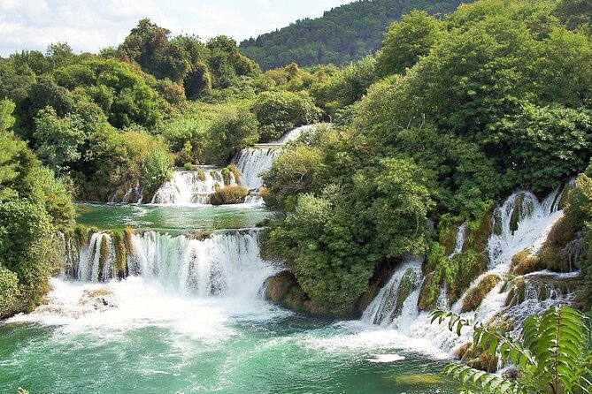 Private Krka Waterfalls Tour with Wine Tasting from Sibenik - Walking the wooden paths at Skradinski Buk