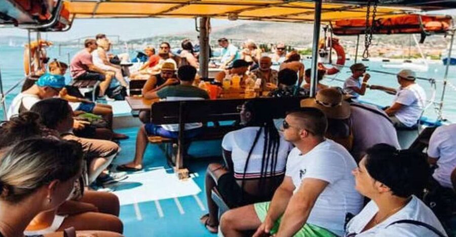 Split: Blue Lagoon Boat Trip with Lunch, Wine and Snorkeling - Leaving Split with the City in View