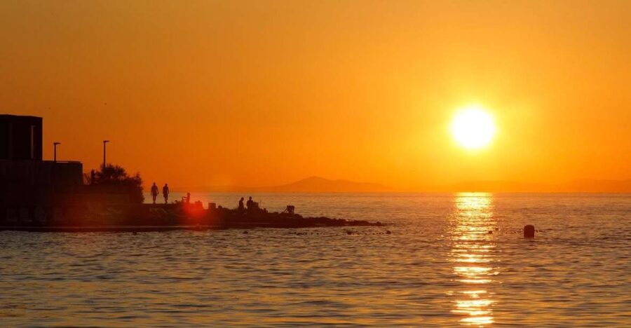 Split: Brac Island and Sutivan Village Sunset Boat Tour - Sunset over the sea from the boat