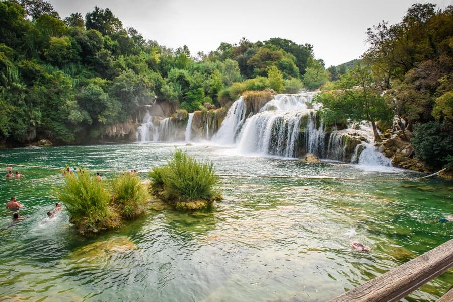 Split/Trogir: Krka National Park Day Trip & Boat to Skradin - Old mills and stone houses near the river