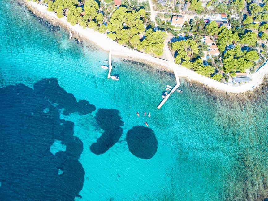 Trogir: Blue Lagoon, Maslinica, and Solinska Bay Boat Tour - Maslinica: A Village Break with Castle Views